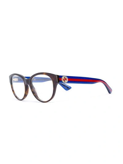 Shop Gucci Interlocking Gg Oval-frame Glasses