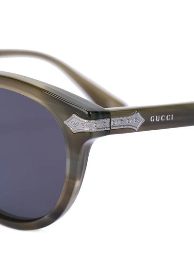 Shop Gucci Eyewear Line Effect Oval Sunglasses - Green