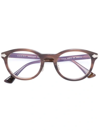 Shop Gucci Debossed Detailing Round-frame Glasses In Brown