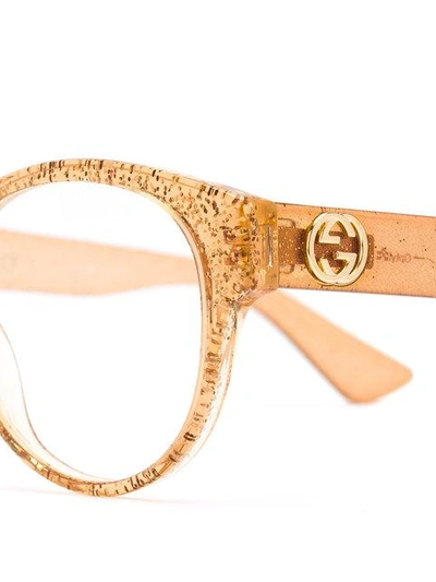 Shop Gucci Transparent Glitter Curved Glasses