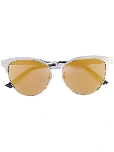 Shop Gucci Eyewear Cat Eye Engraved Sunglasses - Metallic