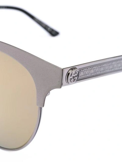 Shop Gucci Eyewear Cat Eye Engraved Sunglasses - Metallic