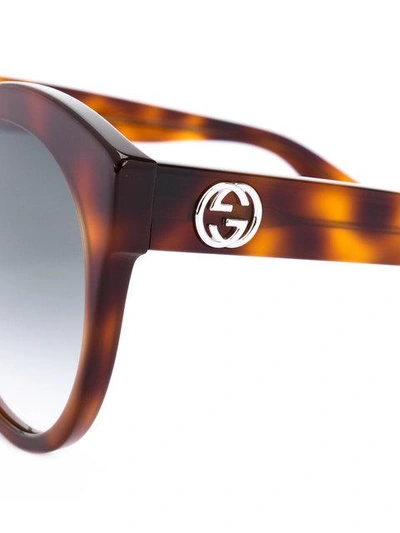 Shop Gucci Rounded Tortoiseshell Sunglasses In Brown