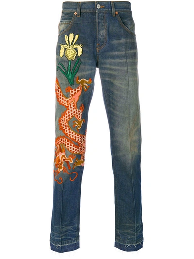 Gucci Embroidered Dragon Stone-washed Tapered Jeans In Blue