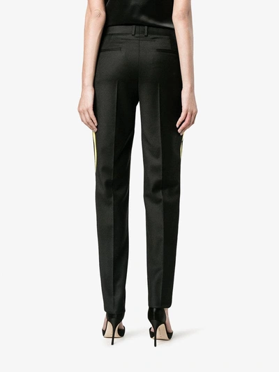 Shop Givenchy Side Striped Trousers In Black