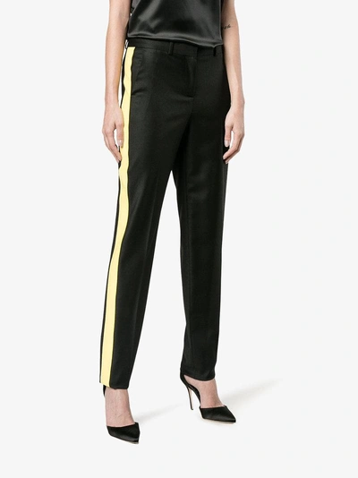 Shop Givenchy Side Striped Trousers In Black