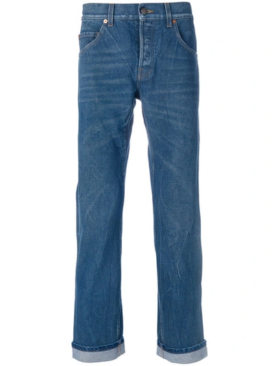 Shop Gucci Embroidered Tapered Jeans - Blue