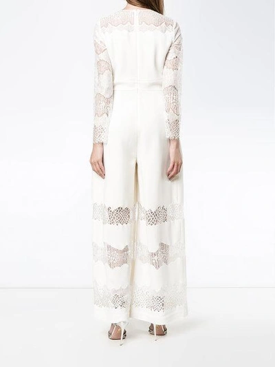 Shop Huishan Zhang V-neck Lace Jumpsuit In White