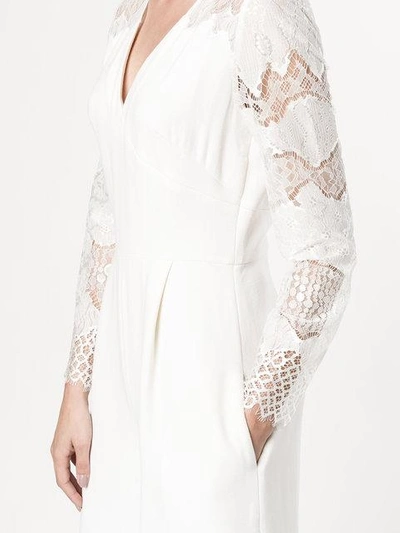 Shop Huishan Zhang V-neck Lace Jumpsuit In White