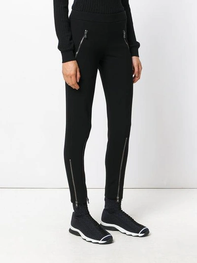 Shop Moschino Zip Up Trousers In Black
