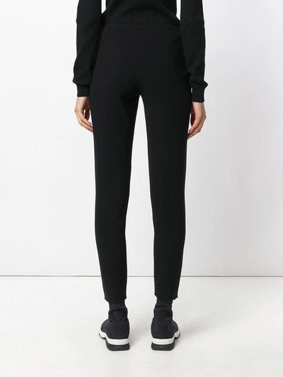 Shop Moschino Zip Up Trousers In Black