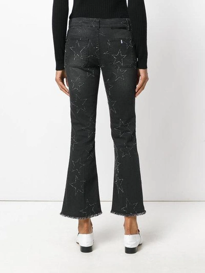 Shop Stella Mccartney Star Stitched Crop Flare Jeans In Black