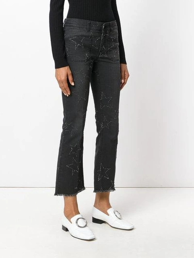 Shop Stella Mccartney Star Stitched Crop Flare Jeans In Black