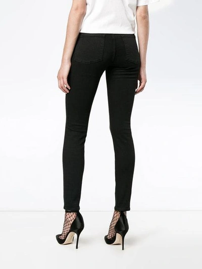 Shop Frame Le Color Black Mid Rise Skinny Jeans