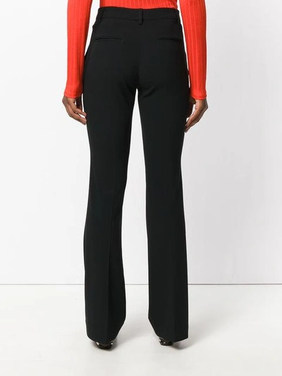 Shop Etro Flared Trousers - Black