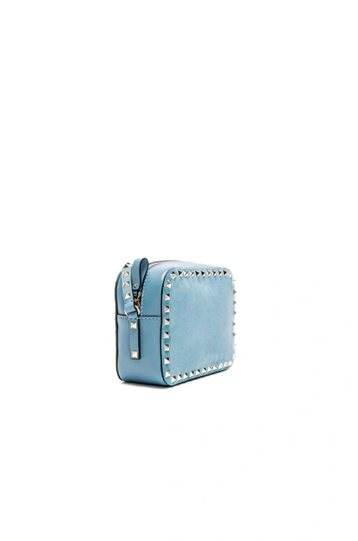 Shop Valentino Rockstud Suede Crossbody Bag In Blue