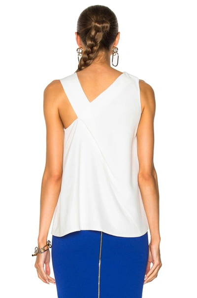 Shop Victoria Beckham Fluid Cady Sleeveless Knotted Top In White