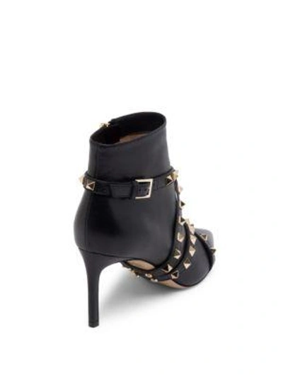 Shop Valentino Stud Wrap Leather Booties In Black