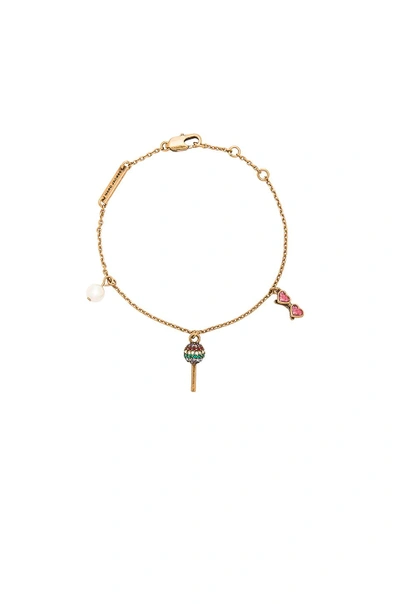 Shop Marc Jacobs Lolli Charm Bracelet In Antique Gold