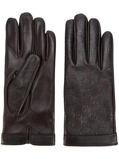 Shop Gucci Gg Supreme Debossed Gloves In Brown