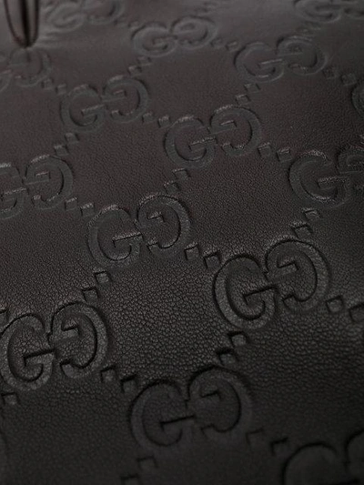Shop Gucci Gg Supreme Debossed Gloves In Brown