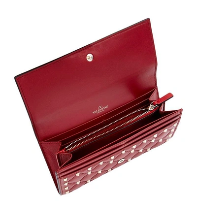Shop Valentino Rockstud Spike Flap Wallet In Red