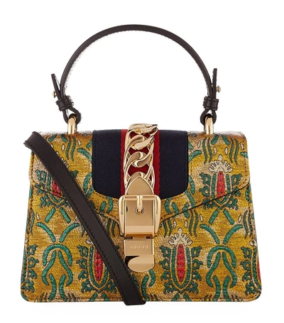 Shop Gucci Oriental Mini Sylvie Bag In Gold