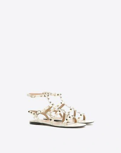 Shop Valentino Garavani Rockstud Calfskin Ankle Strap Flat Sandal In Light Ivory