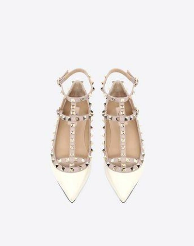 Shop Valentino Garavani Patent Rockstud Caged Ballet Flat In Ivory