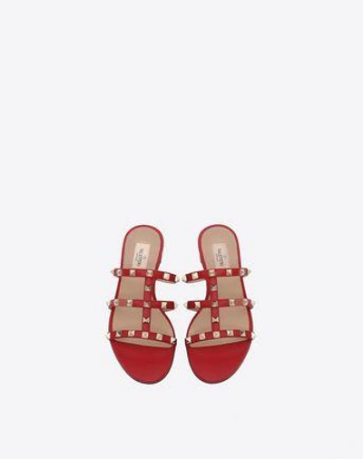 Shop Valentino Garavani Rockstud Flat Slide Sandal In Rosso