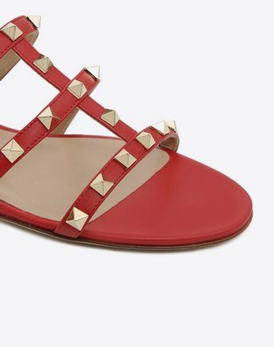 Shop Valentino Garavani Rockstud Flat Slide Sandal In Rosso