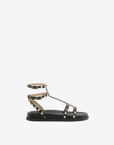 Shop Valentino Rockstud Ankle Strap Flat Sandal In Black