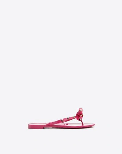 Shop Valentino Jelly Bow Rockstud Thong In Fuchsia