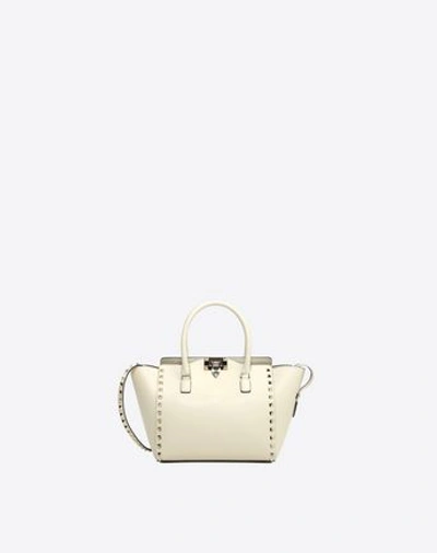 Shop Valentino Small Rockstud Top-handle Bag In Light Ivory