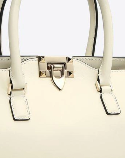 Shop Valentino Small Rockstud Top-handle Bag In Light Ivory