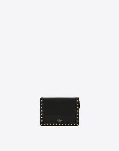 Shop Valentino Rockstud Cross Body Bag In Black