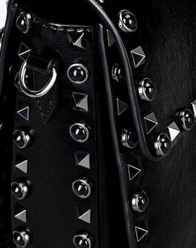 Shop Valentino Rockstud Bag In Black