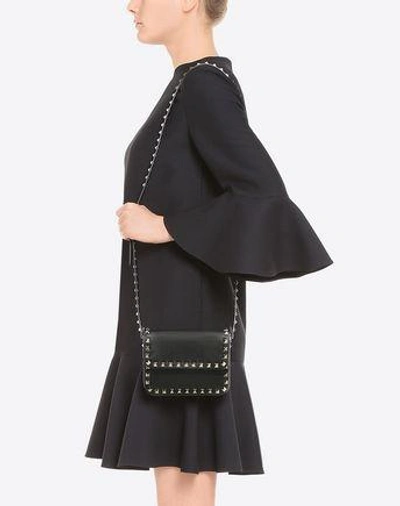 Shop Valentino Rockstud Cross Body Bag In Black