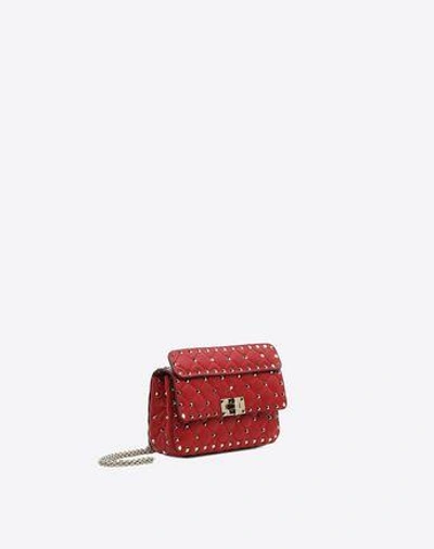 Shop Valentino Garavani Small Rockstud Spike Nappa Leather Bag In Rosso