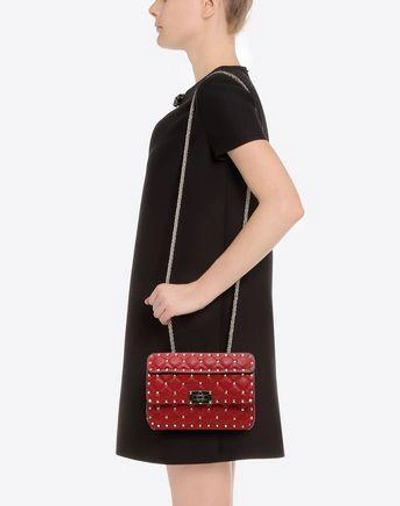 Shop Valentino Garavani Small Rockstud Spike Nappa Leather Bag In Rosso