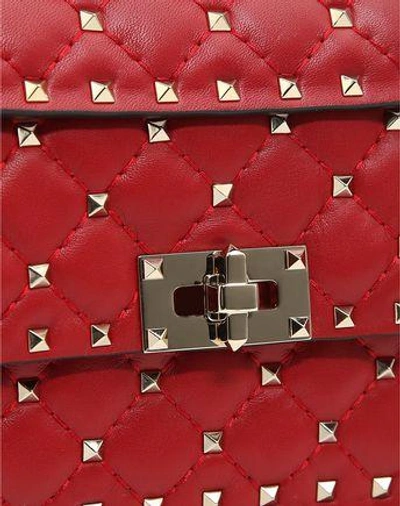 Shop Valentino Garavani Small Rockstud Spike Nappa Leather Bag In Rosso
