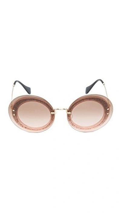 Shop Miu Miu Reveal Glitter Sunglasses In Transparent Pink/pink