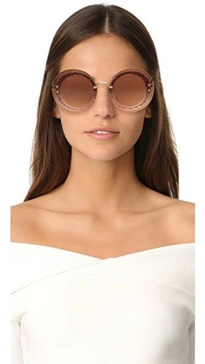 Shop Miu Miu Reveal Glitter Sunglasses In Transparent Pink/pink