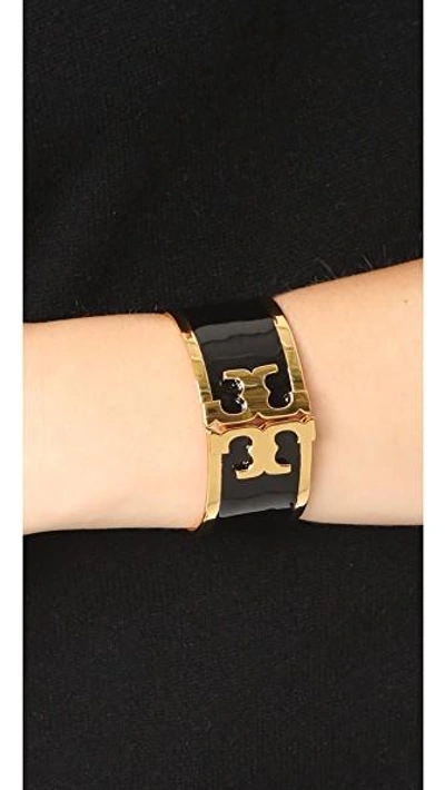 Shop Tory Burch Enamel Raised Logo Wide Cuff Bracelet In Black/tory Gold