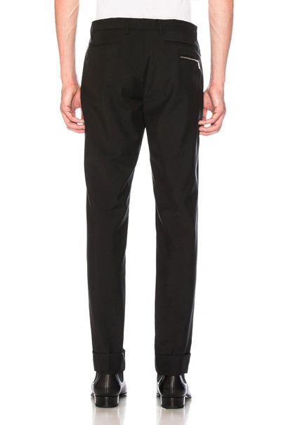 Shop Valentino Zip Pocket Trousers In Black