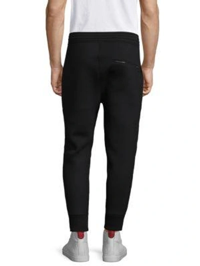 Shop Neil Barrett Modernist Cotton Sweatpants In Black