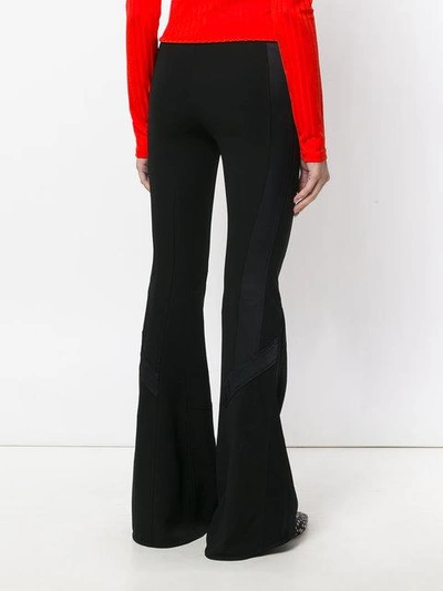 Shop Givenchy Long Flared Trousers In Black