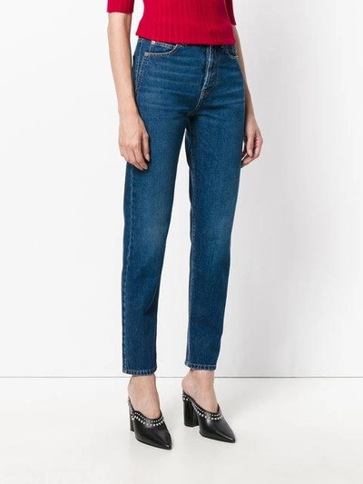 Shop Saint Laurent Logo Embroidered Jeans In Blue