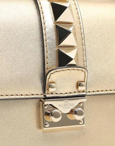 Shop Valentino Small Chain Cross Body Bag In Gold