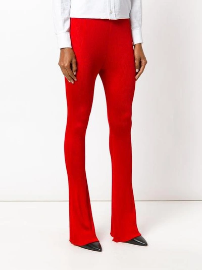Shop Givenchy Flared Ribbed Trousers In Red